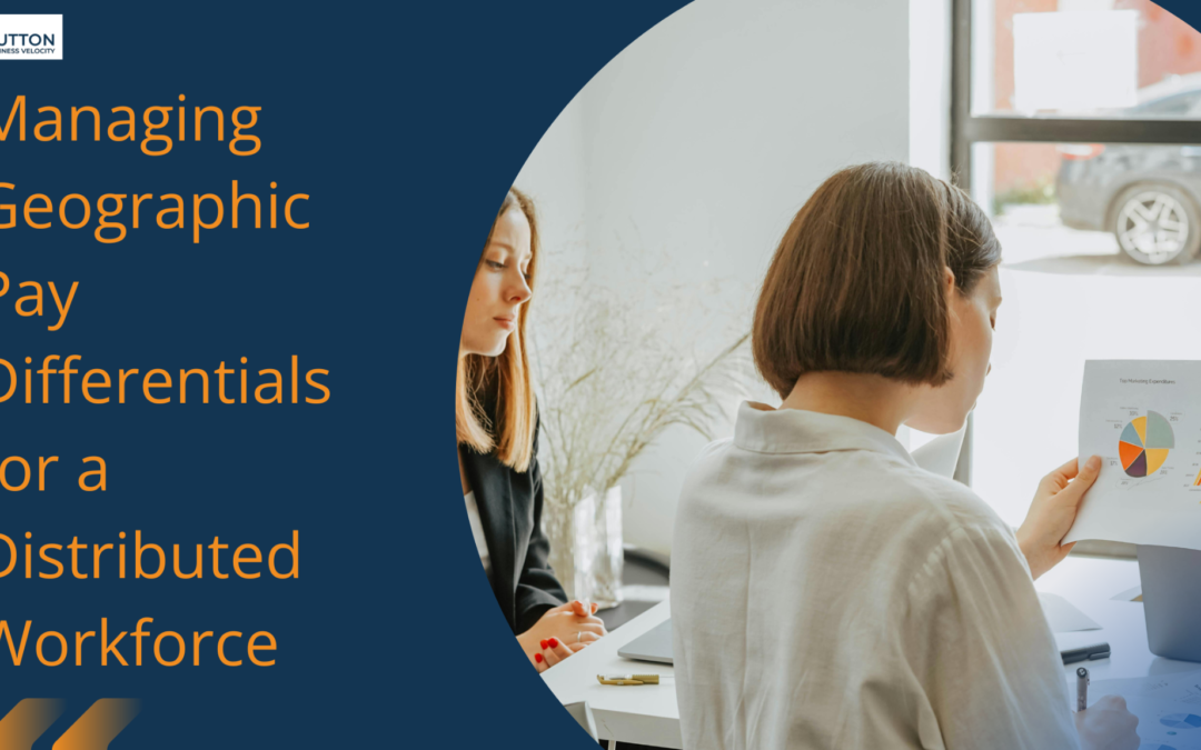 Women reviewing geographic pay differences with a document having graphs and charts.